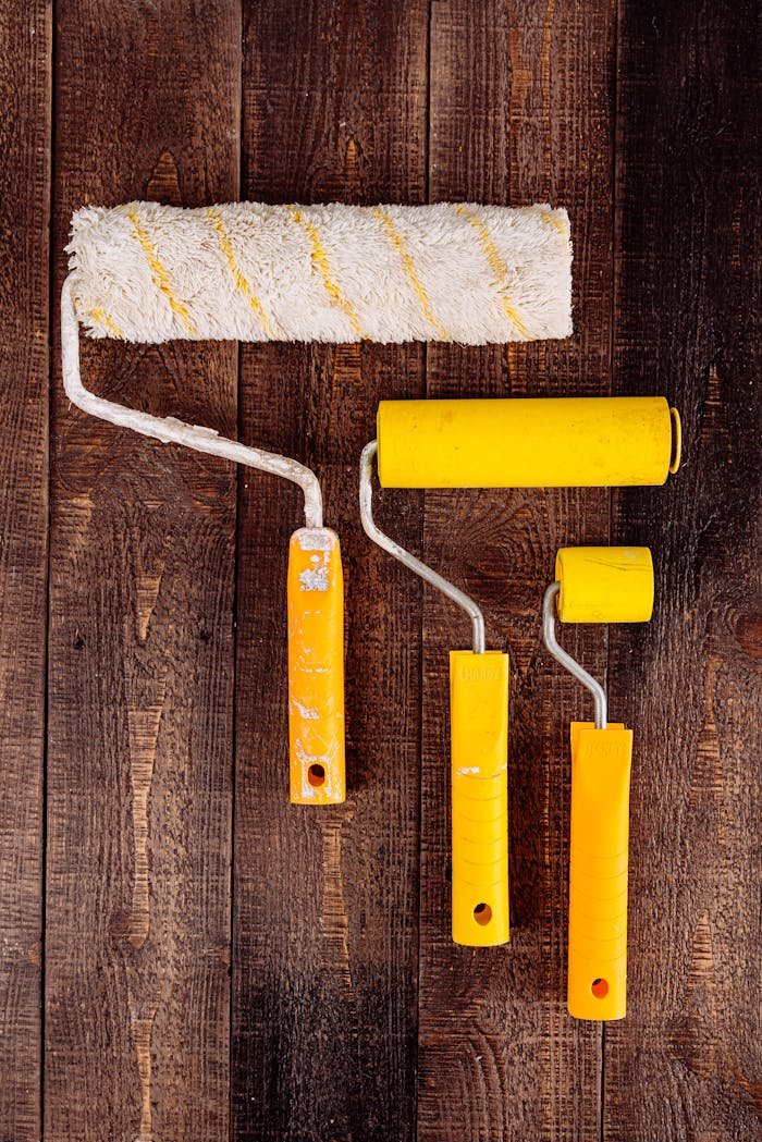 Paint Rollers on Wooden Table
