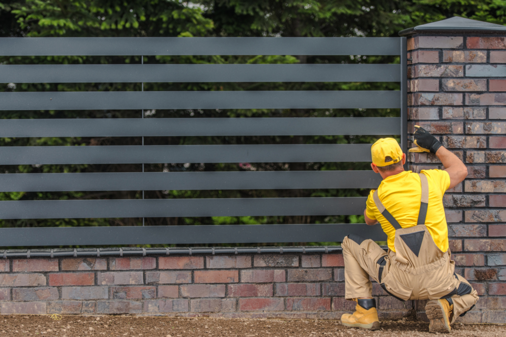 Man inspecting a residential fence